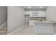 Finished basement bar area features granite countertops and white cabinets at 888 Westcreek Dr, Columbus, IN 47201
