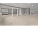 Finished basement with carpet, support columns, and recessed lighting at 888 Westcreek Dr, Columbus, IN 47201