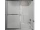 A full tub and shower combo with glass sliding door at 888 Westcreek Dr, Columbus, IN 47201