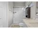 Modern bathroom featuring a glass enclosed shower, granite vanity top, and storage cabinet at 888 Westcreek Dr, Columbus, IN 47201
