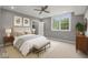A staged bedroom with carpet, a closet, large window and modern decor at 888 Westcreek Dr, Columbus, IN 47201