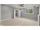 A carpeted bedroom featuring an open closet and a bright window at 888 Westcreek Dr, Columbus, IN 47201