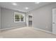 Carpeted bedroom with a bright window and an open closet at 888 Westcreek Dr, Columbus, IN 47201