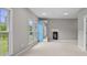 Cozy bedroom with a large window, modern fireplace, and a view of the backyard at 888 Westcreek Dr, Columbus, IN 47201