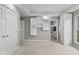 A large bedroom with white walls, plush carpeting, modern storage, and an ensuite bath at 888 Westcreek Dr, Columbus, IN 47201