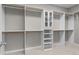 Well-organized walk-in closet with shelving, cabinets, and ample storage space at 888 Westcreek Dr, Columbus, IN 47201
