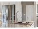 Modern kitchen featuring stainless steel refrigerator, granite counters, and a stylish faucet at 888 Westcreek Dr, Columbus, IN 47201