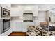 Beautiful kitchen with white cabinets, quartz counters, stainless appliances, and hardwood floors at 888 Westcreek Dr, Columbus, IN 47201