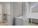 A laundry room featuring a sink, storage, and a dog washing area, with a window letting in natural light at 888 Westcreek Dr, Columbus, IN 47201