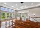 Open concept living space featuring hardwood floors, large windows, and seamless flow to the outdoor living area at 888 Westcreek Dr, Columbus, IN 47201