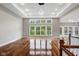 Bright and airy living room featuring hardwood floors, large windows, and elegant recessed lighting fixtures at 888 Westcreek Dr, Columbus, IN 47201