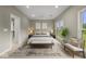 Spacious main bedroom with a large window, ceiling fan, and a walk-in closet at 888 Westcreek Dr, Columbus, IN 47201