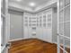 Well-lit office space with hardwood floors and built-in bookshelves for ample storage at 888 Westcreek Dr, Columbus, IN 47201