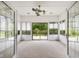 Sunroom features neutral carpet, glass windows, recessed lighting, and a ceiling fan at 888 Westcreek Dr, Columbus, IN 47201
