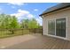 Wooden back deck with railing, glass sliding door, and view of backyard at 932 Silverheels Dr, Westfield, IN 46074