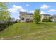 Residential backyard view including a vast lawn and a deck for entertainment at 932 Silverheels Dr, Westfield, IN 46074