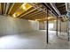 Unfinished basement with concrete floor, exposed beams, and view of support structure at 932 Silverheels Dr, Westfield, IN 46074