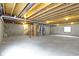 Unfinished basement with exposed beams and concrete floor, offering potential for customization at 932 Silverheels Dr, Westfield, IN 46074