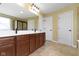 Bathroom with double sink vanity, tile floor, and large mirror at 932 Silverheels Dr, Westfield, IN 46074
