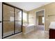 A bathroom with tile flooring and a glass door walk-in shower at 932 Silverheels Dr, Westfield, IN 46074