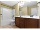 Bathroom featuring double sink vanity, shower-tub combo, and neutral color scheme at 932 Silverheels Dr, Westfield, IN 46074