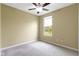 Neutral bedroom features plush carpeting, large window, and a ceiling fan at 932 Silverheels Dr, Westfield, IN 46074