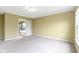 A carpeted bedroom with a doorway leading to an ensuite bathroom at 932 Silverheels Dr, Westfield, IN 46074