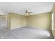 A spacious carpeted bedroom with neutral walls and a ceiling fan at 932 Silverheels Dr, Westfield, IN 46074