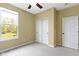 Bedroom with carpeted floor, closet, and large window offering natural light at 932 Silverheels Dr, Westfield, IN 46074