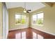 Bright dining room with wood floors, large windows and ceiling fan at 932 Silverheels Dr, Westfield, IN 46074