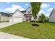 Attractive two-story home with a well-maintained lawn and landscaping at 932 Silverheels Dr, Westfield, IN 46074