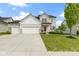 Charming two-story home featuring a three-car garage, manicured lawn, and welcoming curb appeal at 932 Silverheels Dr, Westfield, IN 46074