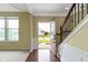 Inviting foyer featuring hardwood floors, a staircase, and plenty of natural light at 932 Silverheels Dr, Westfield, IN 46074