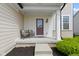 Cozy front porch with seating, offering a welcoming entrance to the home at 932 Silverheels Dr, Westfield, IN 46074