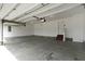 Clean, spacious garage featuring stairs leading to an interior door at 932 Silverheels Dr, Westfield, IN 46074