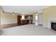 This open-concept space showcases a kitchen, fireplace, and hardwood floors at 932 Silverheels Dr, Westfield, IN 46074
