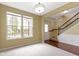 Spacious living area with hardwood floors, staircase, and plenty of natural light at 932 Silverheels Dr, Westfield, IN 46074