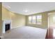 Open living room featuring a fireplace, large windows, and a comfortable carpet at 932 Silverheels Dr, Westfield, IN 46074