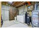 Unfinished basement laundry area featuring a washer, dryer, and utility sink at 965 W Main St, Greenwood, IN 46142