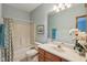 Well-lit bathroom with a shower-tub combo and a vanity at 965 W Main St, Greenwood, IN 46142