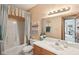 Well-maintained bathroom with a tub, large mirror, and soft lighting at 965 W Main St, Greenwood, IN 46142