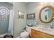 Charming bathroom featuring a decorative mirror and a wood vanity at 965 W Main St, Greenwood, IN 46142