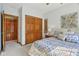 Comfortable bedroom with double closets, neutral walls, and a decorative wall hanging at 965 W Main St, Greenwood, IN 46142