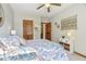 Well-lit bedroom with carpet, wooden doors, and tasteful wall decor at 965 W Main St, Greenwood, IN 46142