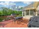 Spacious deck featuring a dining table and grill at 965 W Main St, Greenwood, IN 46142