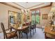Formal dining room featuring a chandelier, ornate molding, and views to the front yard at 965 W Main St, Greenwood, IN 46142