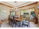 A dining room featuring a chandelier and views of the living spaces at 965 W Main St, Greenwood, IN 46142