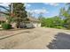 Large concrete driveway and three car garage with basketball net in the backyard at 965 W Main St, Greenwood, IN 46142