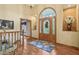 Lovely foyer with hardwood floors, an arched window, and decorative glass front door at 965 W Main St, Greenwood, IN 46142
