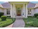 Inviting home entrance with classic columns and detailed landscaping at 965 W Main St, Greenwood, IN 46142